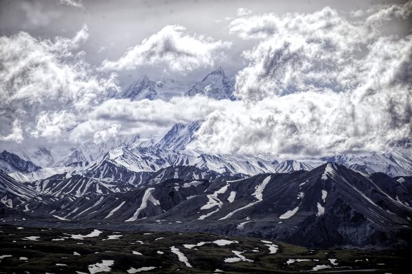 Denali Mountain with its peak in the clouds.